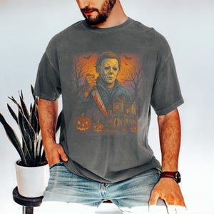 Vintage-style Michael Myers t-shirt printed on soft Comfort Colors® fabric. Perfect for Halloween parties, horror fans, or scary movie nights. This spooky tee features the iconic serial killer in retro style — a great gift for lovers of classic slasher films.