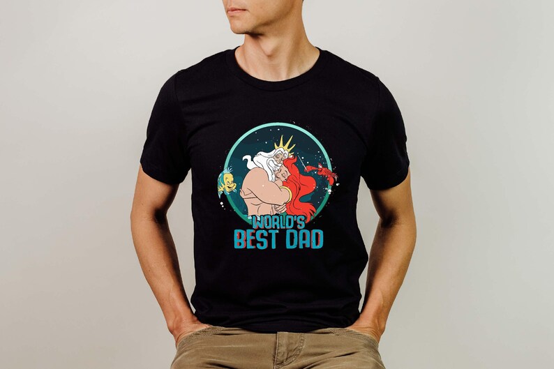 🌊 Little Mermaid Ariel Dad King Triton Shirt – Comfort Colors® Father’s Day Tee
Celebrate the king of your world with this Little Mermaid Dad shirt! Featuring King Triton and playful nods to the world’s greatest dad, this cozy Comfort Colors® tee is the perfect Father’s Day gift, Disney trip shirt, or everyday tribute to the best dad ever.

🎁 Ideal for Disney dads, Father's Day celebrations, and magical family vacations!