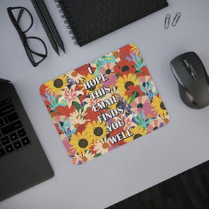 May include: A colorful mousepad with a floral pattern and the text "I hope this email finds you well".