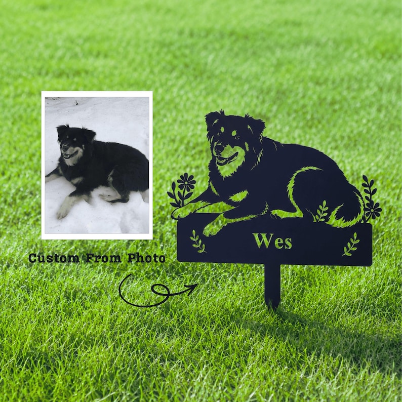 May include: A black metal garden stake featuring a silhouette of a dog lying down, with the name "Wes" on a sign. The stake is placed in green grass, with a photo of the dog in the upper left corner. Text reads "Custom From Photo".