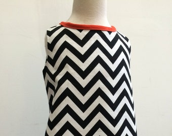 Black and white chevron print A line dress with orange piping