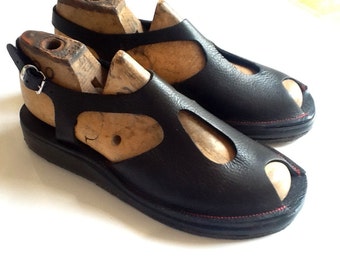 Handmade wedge sandal with peep toe and rubber sole by designer Emily Spray