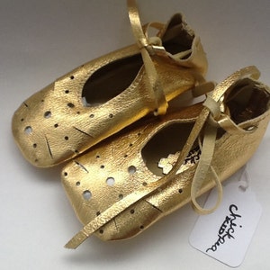 Gold baby ballet shoes