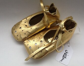 Gold baby ballet shoes