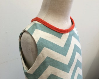 Teal chevron print A line dress with orange piping