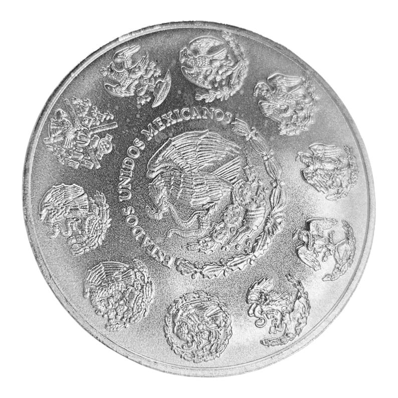 May include: Silver coin with the text "Estados Unidos Mexicanos" and an eagle design.