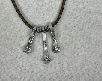 Horse shoe nail leather cord necklace made in Texas