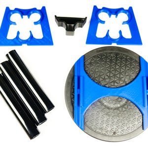 May include: An assortment of 3D-printed parts in blue and black, including support brackets, a small connector, and several cylindrical rods. The parts are arranged on a white background, suggesting a kit or set of components.