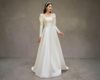 Elegante vestido de novia de corte A con escote cuadrado: mangas largas.