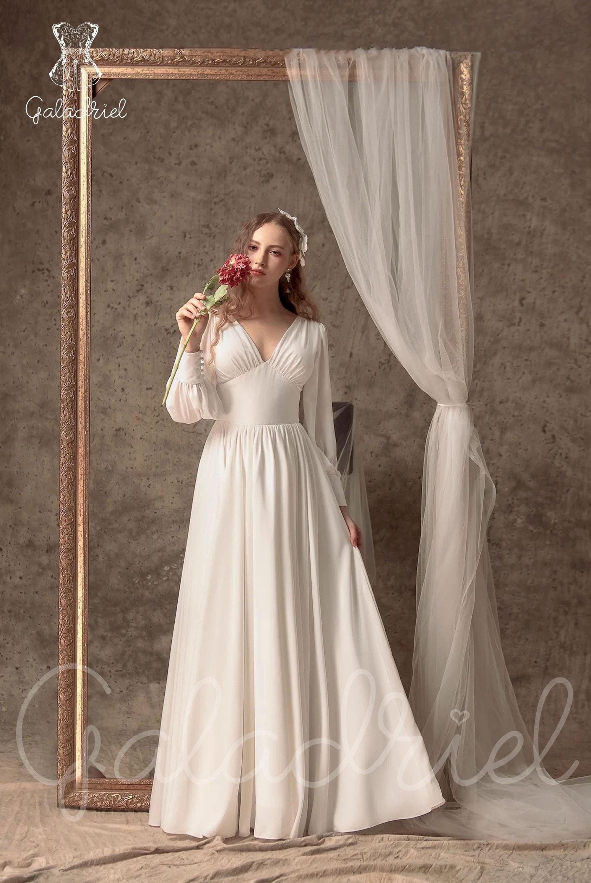 empire waist dress canada Empire Waist Metallic Knit Dress with Surplice Neckline, Flutter Sleeves, Embellishment Detail at Hip and Cascade Skirt main image 0