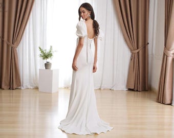 Vestido de novia rústico con mangas abullonadas, escote cuadrado y espalda abierta.