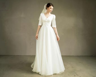 Vestido de novia sencillo de corte A: mangas largas, espalda descubierta, vestido de novia modesto