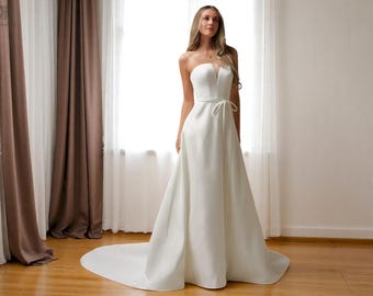 Satin A-Line Wedding Dress: Strapless Ivory Bridal Gown with Bow