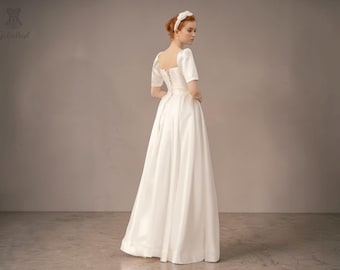 Vestido de novia minimalista: escote corazón, cintura imperio.