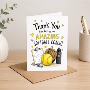 May include: A white greeting card with the black and yellow text Thank You for being an AMAZING SOFTBALL COACH! The design features illustrations of a clipboard with a field diagram, a brown leather glove, a yellow softball, and a black water bottle.