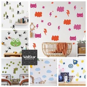 A collage of wall decals for kids by Wall Star Graphics consisting of Big Foot, superhero themed, frogs, dinosaurs, puffy clouds, stars, and rocket ships.