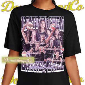 May include: A black t-shirt featuring a graphic collage of a basketball player named Kaitlyn Chen. The design includes multiple images of the athlete in a black uniform holding a basketball, with the text KAITLYN CHEN and BASKETBALL PLAYER.