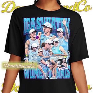 May include: Black t-shirt featuring a collage of images of Iga Swiatek, a professional tennis player, with the text "IGA SWIATEK" in blue and purple. The words "WOMEN'S TENNIS" are also displayed in a similar style.