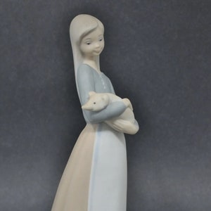 Lovely retired Lladro Little girl with piglet. Pristine condition.