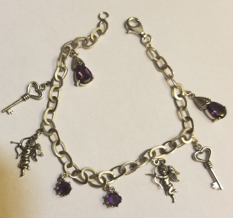 Vintage Sterling silver Amethyst and Charm Bracelet.