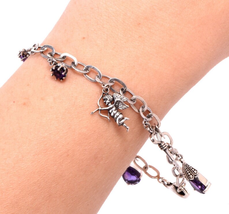 Vintage Sterling silver Amethyst and Charm Bracelet.