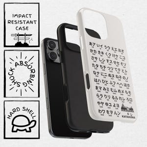May include: White phone case with a black border and a Japanese alphabet chart printed on the back. The chart includes the hiragana and katakana alphabets. The case is designed to protect the phone from impact and shock.