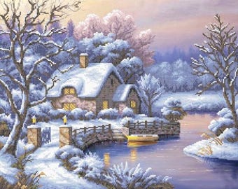 May include: A cross-stitch design depicting a snow-covered cottage scene. The cottage has a snow-laden roof, with lit windows. A small yellow boat floats on the water. The trees and surrounding landscape are covered in snow, creating a wintery atmosphere.