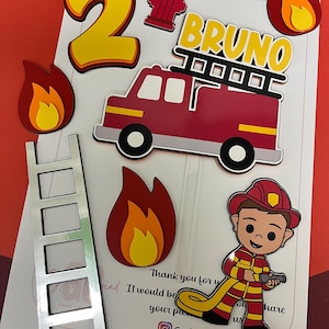 May include: A set of fire-themed cake toppers featuring a large yellow number 2, a red fire hydrant, a red fire engine with a ladder, a cartoon firefighter in uniform, a silver ladder, and three flame cutouts with the name BRUNO in yellow text.