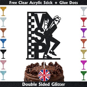 May include: A black glitter cake topper with a silhouette of a man in a suit and the letters VSP. The cake topper is on a chocolate cake. The text "Double Sided Glitter" is at the bottom. Includes a Union Jack sticker.
