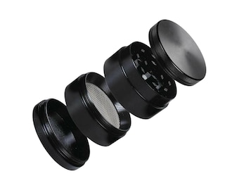 May include: A black metal grinder with four separate pieces. The grinder has a textured surface and a small screen.