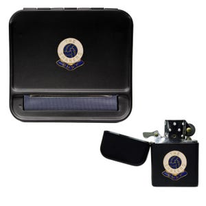May include: Black metal rolling box and lighter set. The rolling box has a blue rolling surface and a circular emblem. The lighter is open, revealing a black interior, and also features the emblem. The emblem reads "THE SHAKERS BURY".