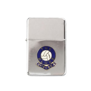 May include: Silver lighter with a blue and gold Chelsea Football Club logo. The logo features a football and the text "The Blues Chelsea".