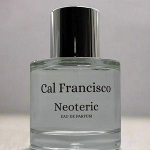 May include: A clear glass bottle of Cal Francisco Neoteric Eau de Parfum. The bottle has a silver cap and a white label with black text.