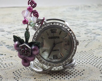 Small Geneva table clock with silver and abalone face and striking grape cluster charm and beads for bling to please romantic or artist.