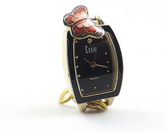 Small black and gold table clock made from Essie watchface featuring colorful butterfly charm to fit in a nook or child's room for nature.