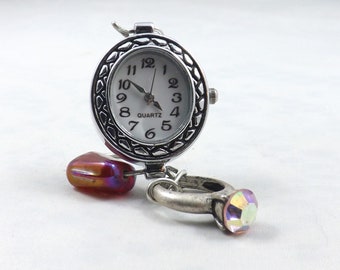 Mini table clock for any nook or be an engagement present, with a pretty pink engagement ring on round silver clock and red bead for bling/