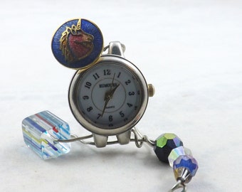 Miniature clock to fit any nook and please whoever loves unicorns and bling with colorful beads and a round repurposed silver watch face.