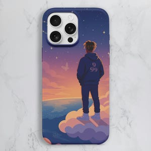 May include: A phone case featuring a stylized illustration of a person standing on a cloud, gazing at a sunset. The person is wearing a blue hoodie with the number "99" on the back. The case has a dark blue border and a starry sky design.