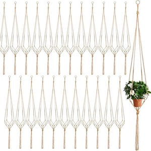 May include: A collection of macrame plant hangers in a natural beige color, with a single plant in a terracotta pot displayed in one. The hangers are made of woven rope and feature a geometric design, perfect for displaying plants.