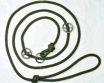 May include: A green rope dog leash with three metal rings. The leash is coiled and has a loop at one end.