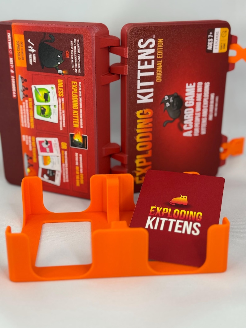 Custom 3D-printed storage box for Exploding Kittens. Holds cards securely with a built-in divider, doubles as a deck and discard holder. UV-printed artwork ensures crisp, vibrant designs. Perfect for organising and upgrading your game night setup.