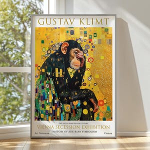 May include: A framed art print featuring a chimpanzee in the style of Gustav Klimt. The artwork has a gold background with colorful geometric shapes and the text "GUSTAV KLIMT" at the top. The print also includes text about the Vienna Secession Exhibition.