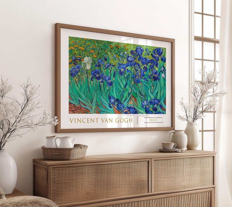May include: A framed print of a painting by Vincent van Gogh featuring a field of blue irises with green leaves. The title of the painting is "Irises" and the artist's name is "Vincent van Gogh".