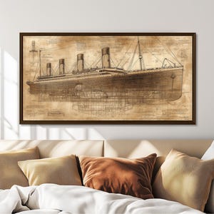May include: A vintage-style illustration of the RMS Titanic, a passenger liner that sank in the North Atlantic Ocean in 1912. The illustration is in sepia tones and shows the ship's profile, with its deck and hull visible. The illustration is framed in a brown wood frame.