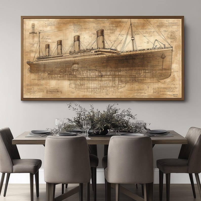 May include: A sepia-toned blueprint style illustration of the RMS Titanic, a large passenger liner, with detailed drawings of the ship's interior and exterior. The image is framed in a brown wood frame and hangs on a light gray wall above a dining table with chairs.