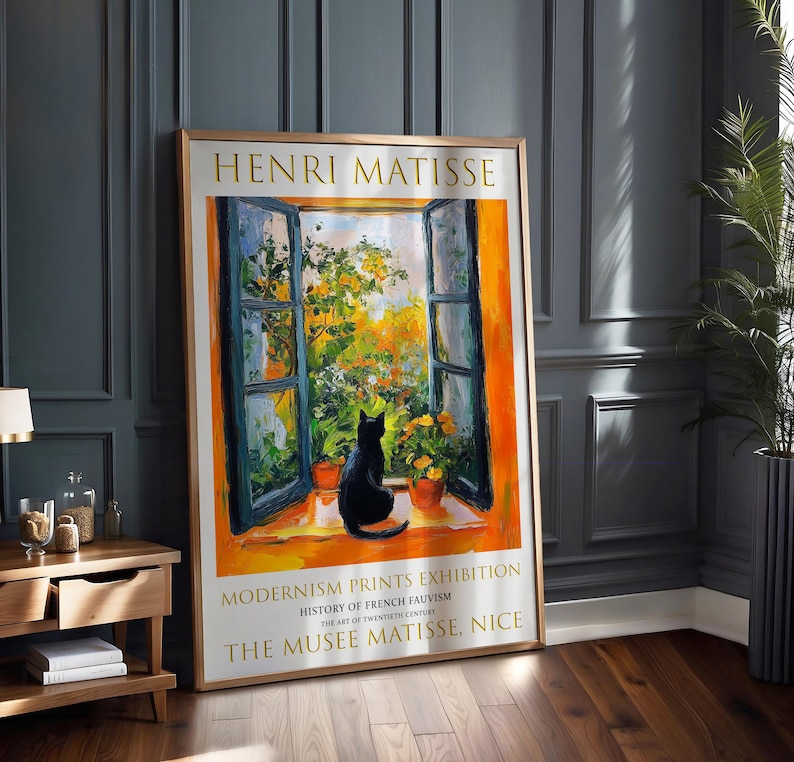 May include: A poster advertising a Henri Matisse exhibition at the Musee Matisse in Nice, France. The poster features a painting of a window with a black cat sitting on the windowsill. The text on the poster reads "Henri Matisse, Modernism Prints Exhibition, History of French Fauvism, The Art of Twentieth Century, The Musee Matisse, Nice."