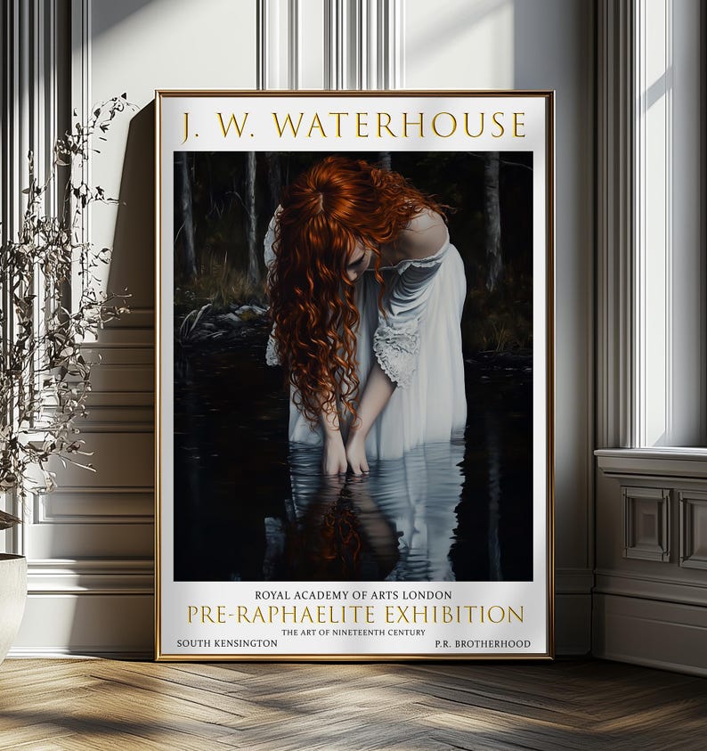 May include: A framed art print of a J.W. Waterhouse painting. It shows a woman with flowing red hair in a white dress, standing in water. The gold frame surrounds the artwork, with text reading "PRE-RAPHAELITE EXHIBITION".