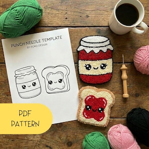 May include: A wooden table displays a punch needle template with a cute jam jar and toast design. The text "PUNCH NEEDLE TEMPLATE" and "PDF PATTERN" are visible. A cup of coffee, yarn, and a punch needle tool are also present.