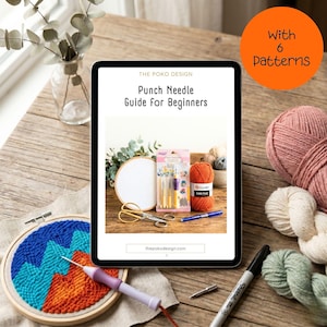 May include: An iPad displays "Punch Needle Guide for Beginners" by The Poko Design. The image includes punch needle supplies: yarn, needles, scissors, and a partially completed embroidery hoop with a mountain design. An orange circle reads "With 6 Patterns."