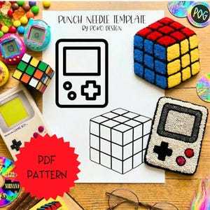 May include: A collection of retro-themed items, including a colorful Rubik's Cube, a Game Boy, and a punch needle template with a game console design. The image also features a completed, textured Rubik's Cube and a game console rug.